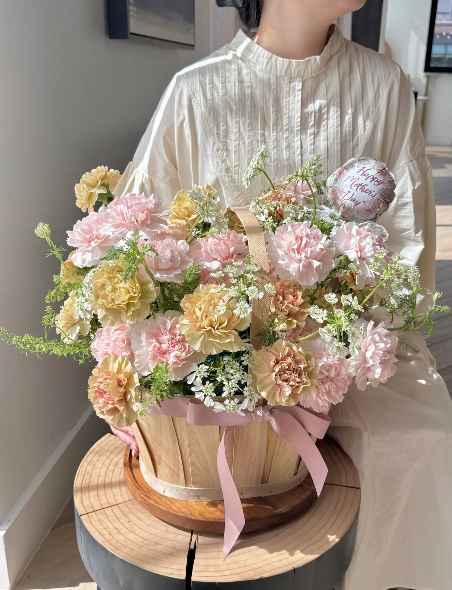 Soft pinks and buttery yellows, tucked into a wooden basket— just like a warm hug from the heart. Happy Mother's Day, to the one who makes everything bloom.
