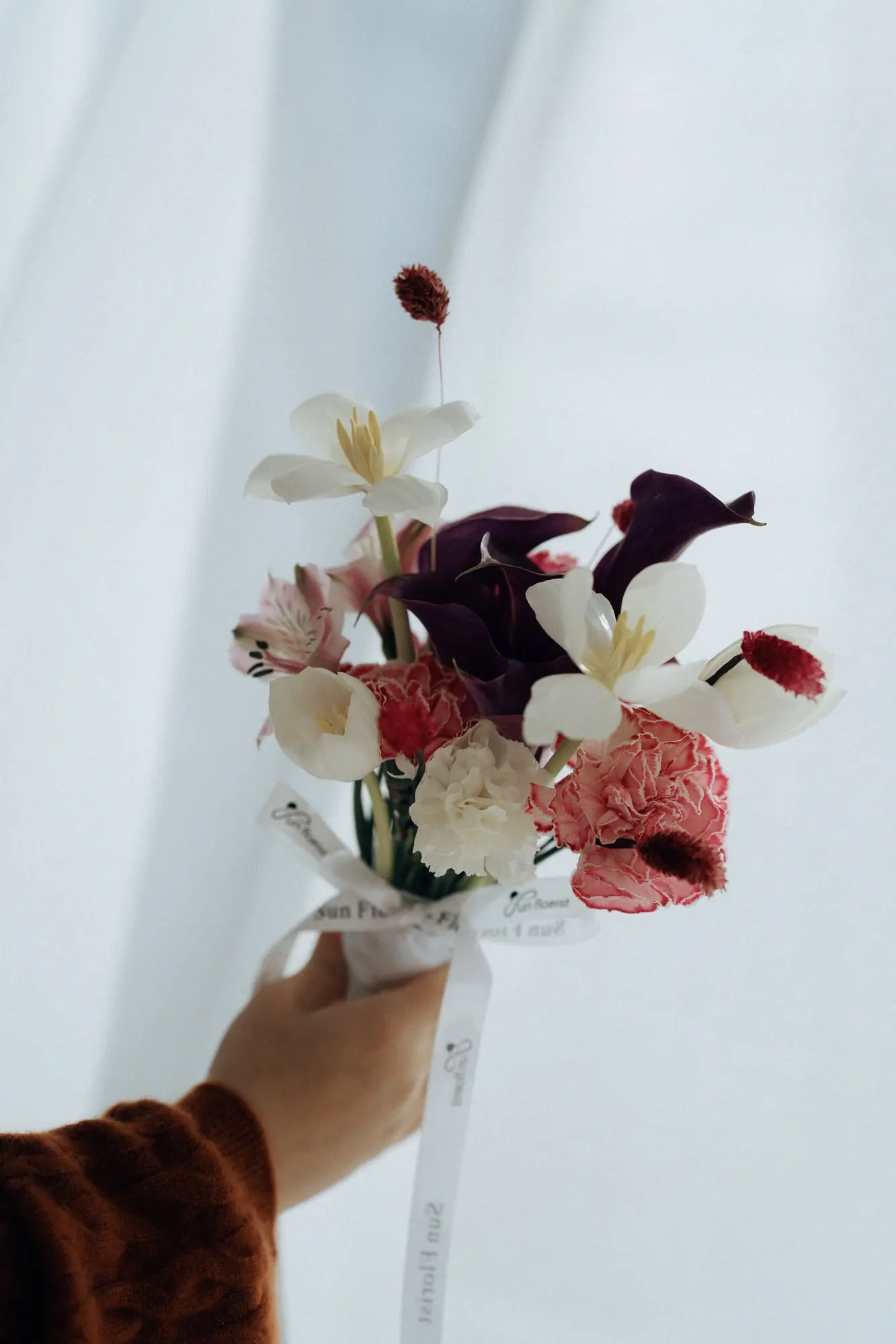 Calla Lily Mini Cranberry — hand-composed fresh florals by Sun Florist, made to order.