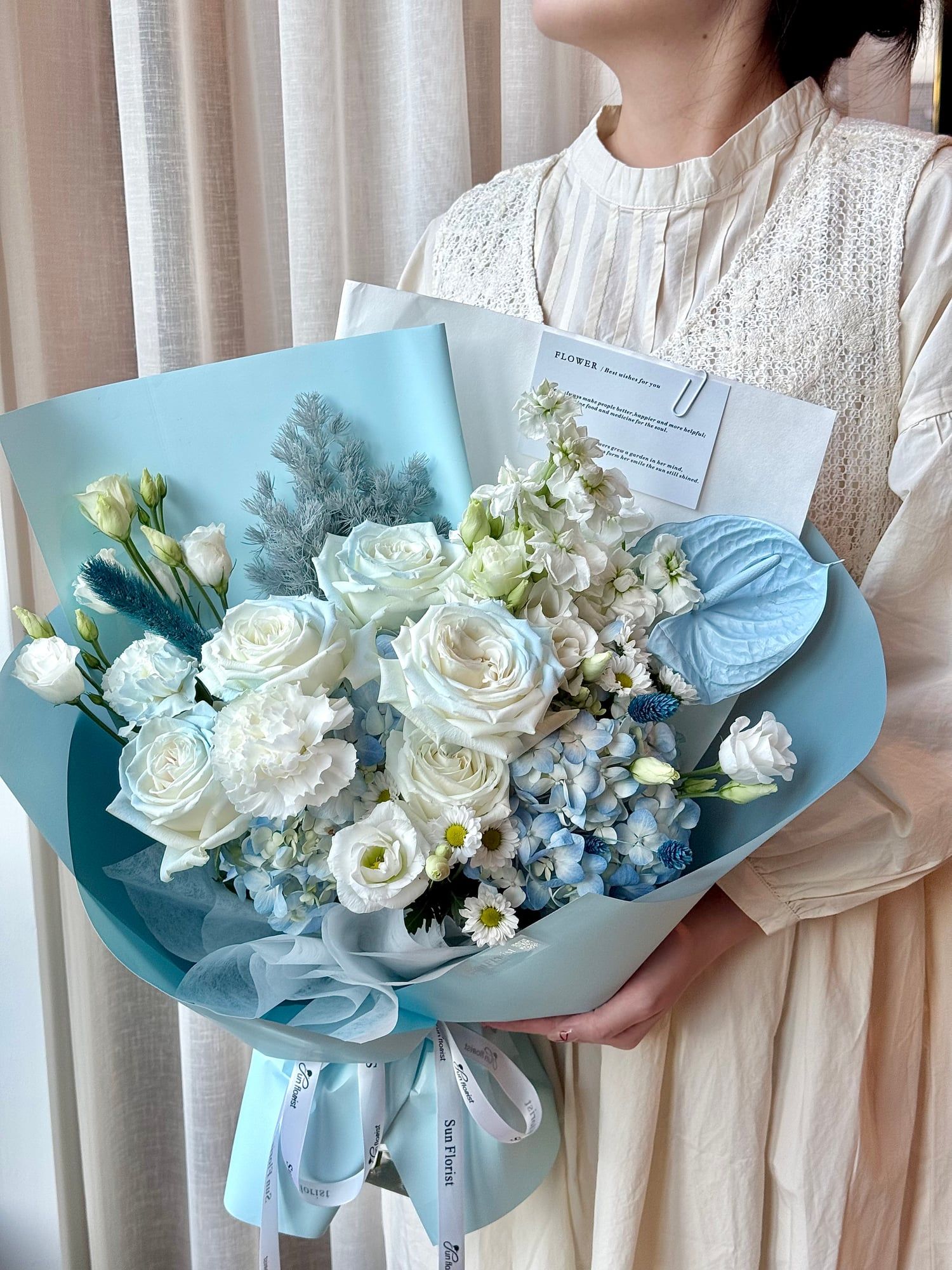 Inspired by the serene hues of North Carolina skies, this bouquet blends elegance and tranquility.