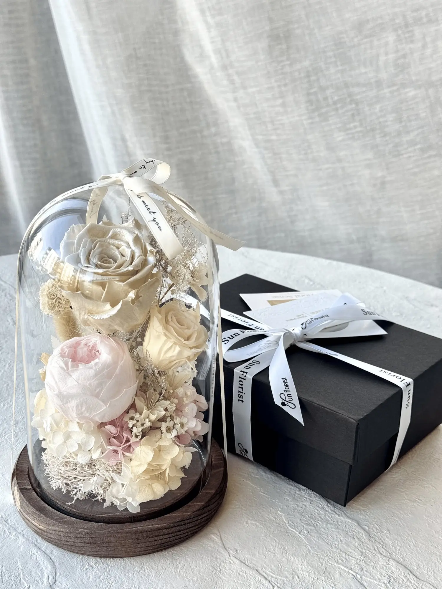 Preserved flower arrangement in muted tones