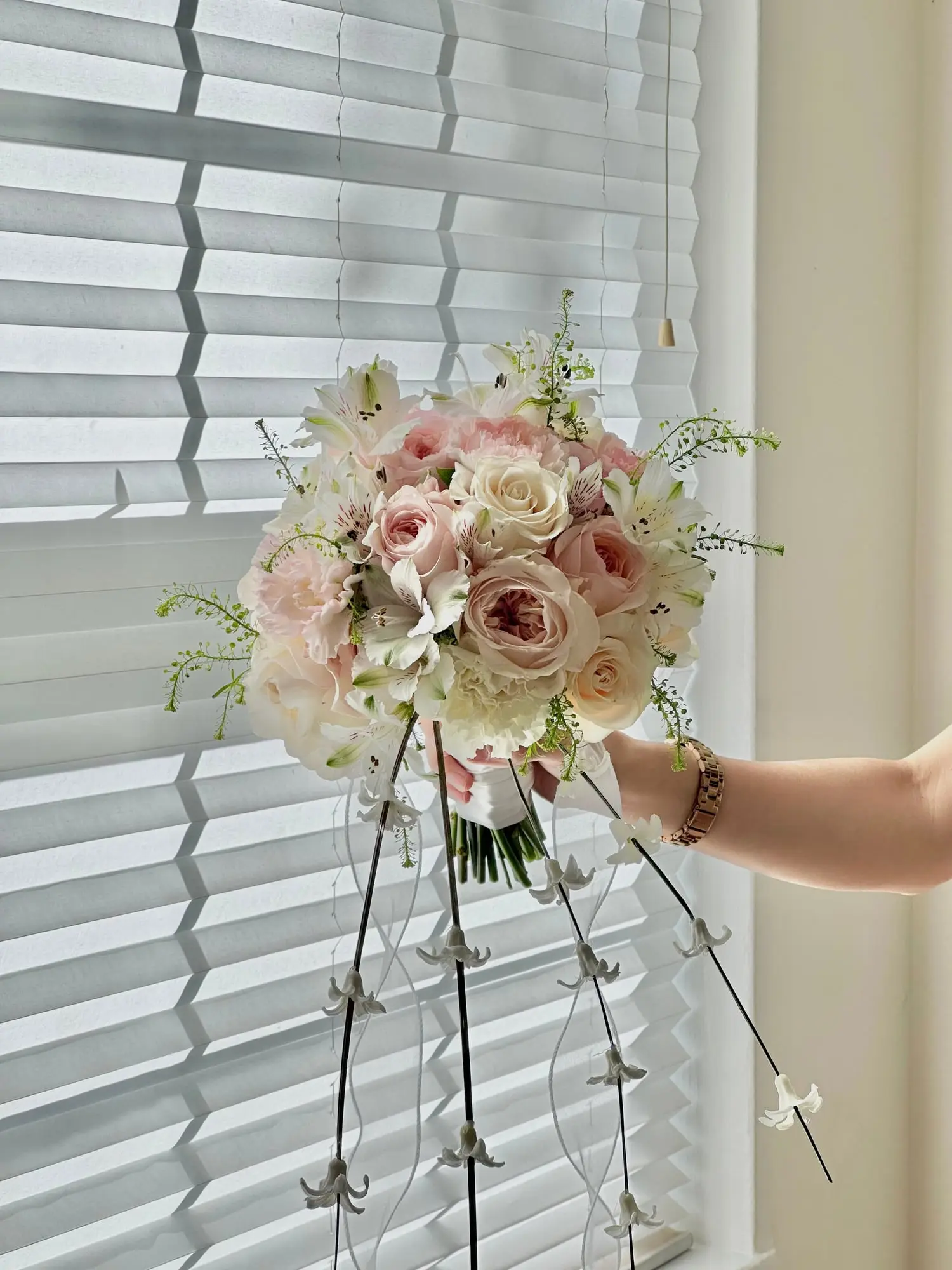 A bridal bouquet with airy drapes and delicate flow — perfect for a graceful walk down the aisle.