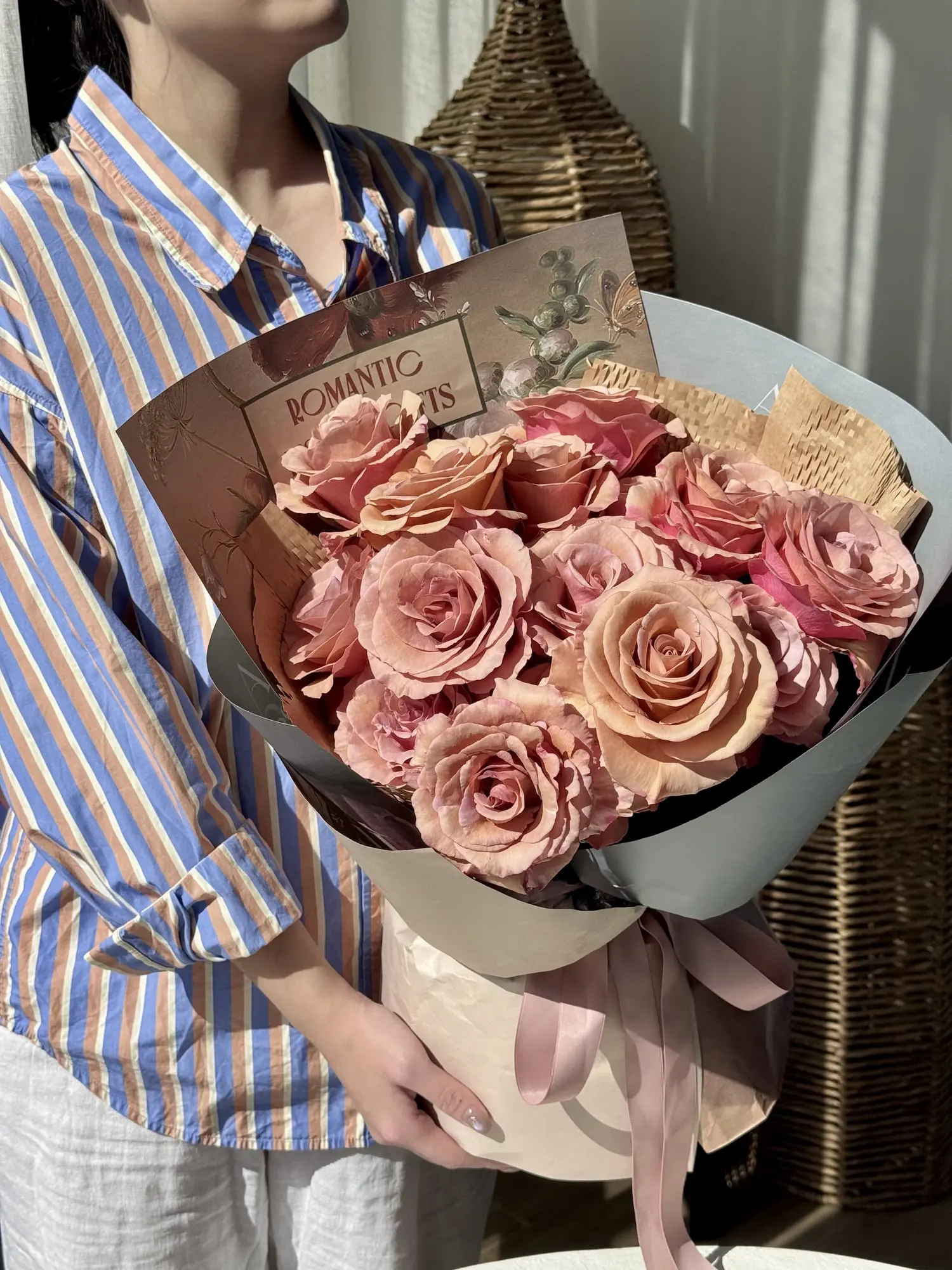 This elegant bouquet features Moab roses in rich, warm hues of blush, nude, and dusty pink.